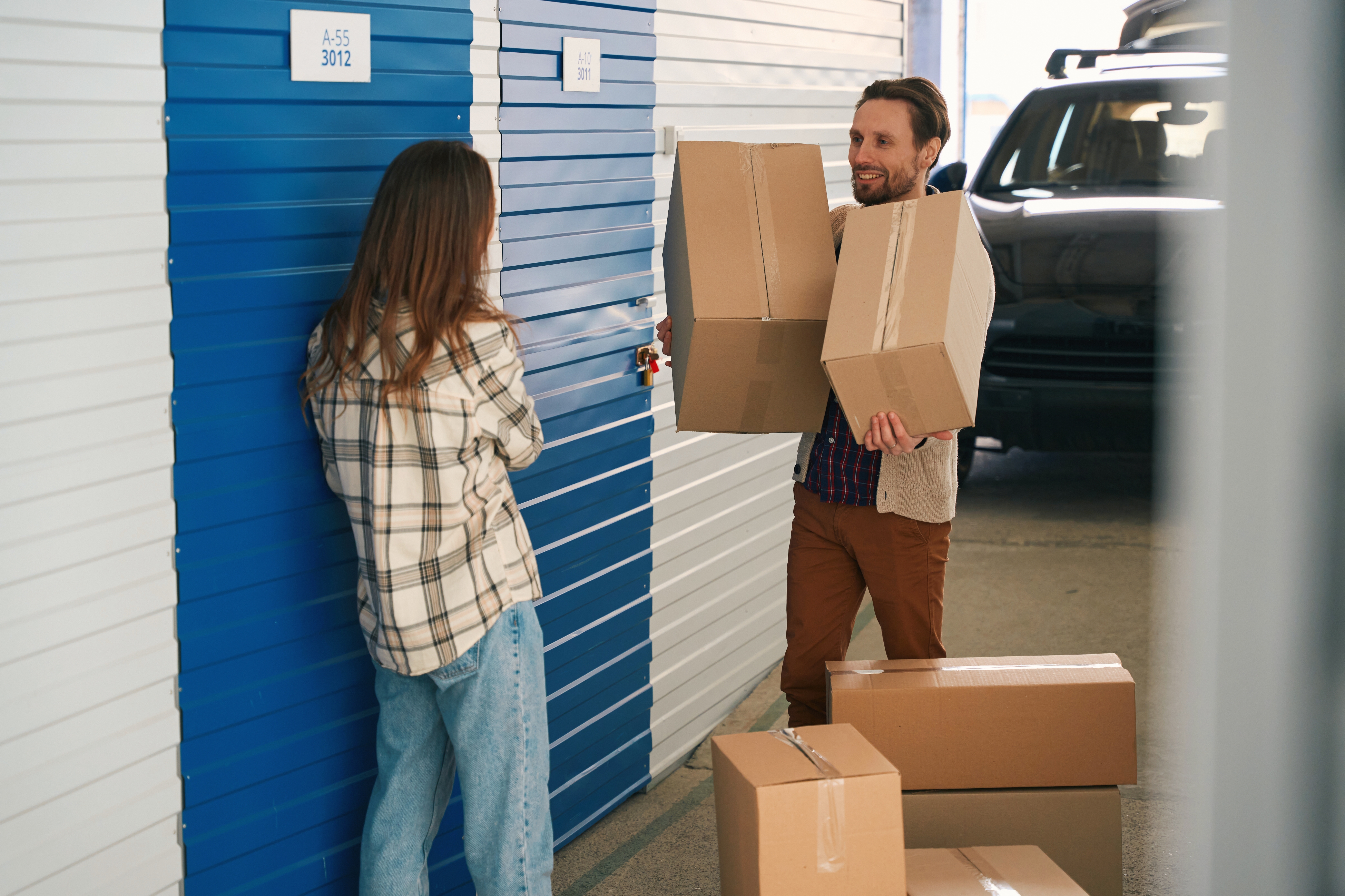 Storage Tenants Arriving With Boxes